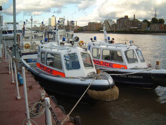 Two single engined police launches at Wapping.